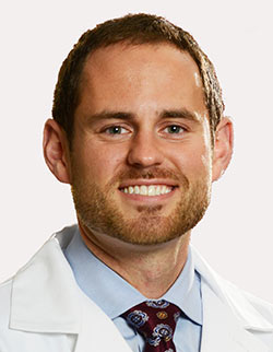 "Dr. James Carr HSS sports medicine expert treating athlete"